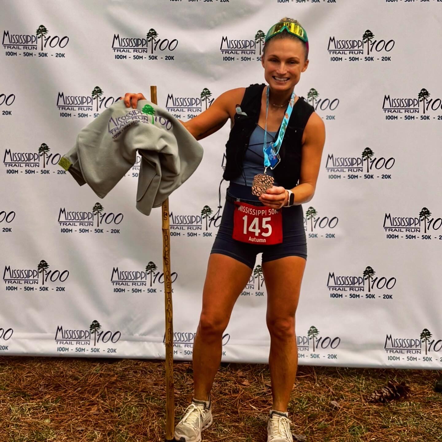 Holding my award after Mississippi Trail 50